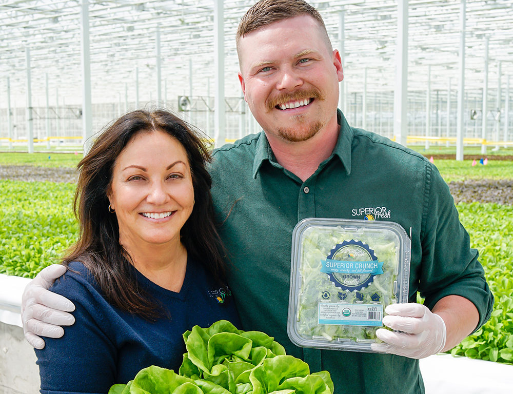 Karen Wanek, owner and co-founder of Superior Fresh LLC, stands with company President Brandon Gottsacker at their greenhouse in Northfield, Wisconsin. Photo: Superior Fresh