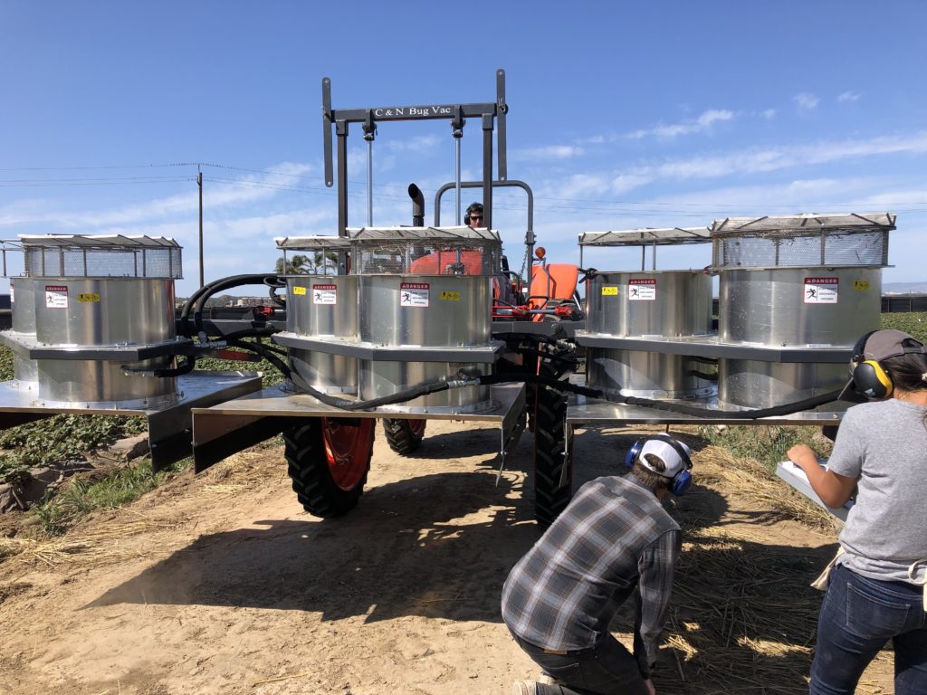 Members of the machine’s research team record data on this double barrel vacuum. Photos: California Strawberry Commission