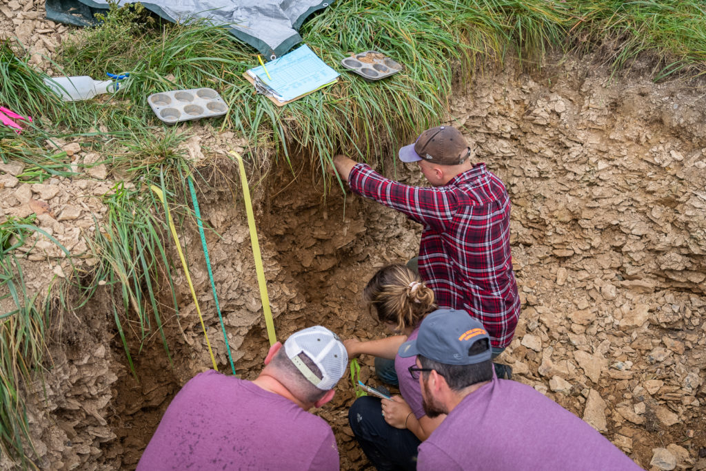 Participants collect the soil samples from their designated sites during the Northeast Regional Soil Judging Contest at the Rodale Institute. Credit: Rodale Institute