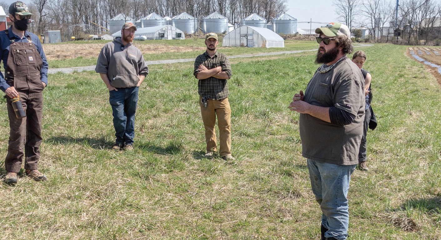 Kegan Hilare, right, is a consultant for growers looking to make decisions about their farms.