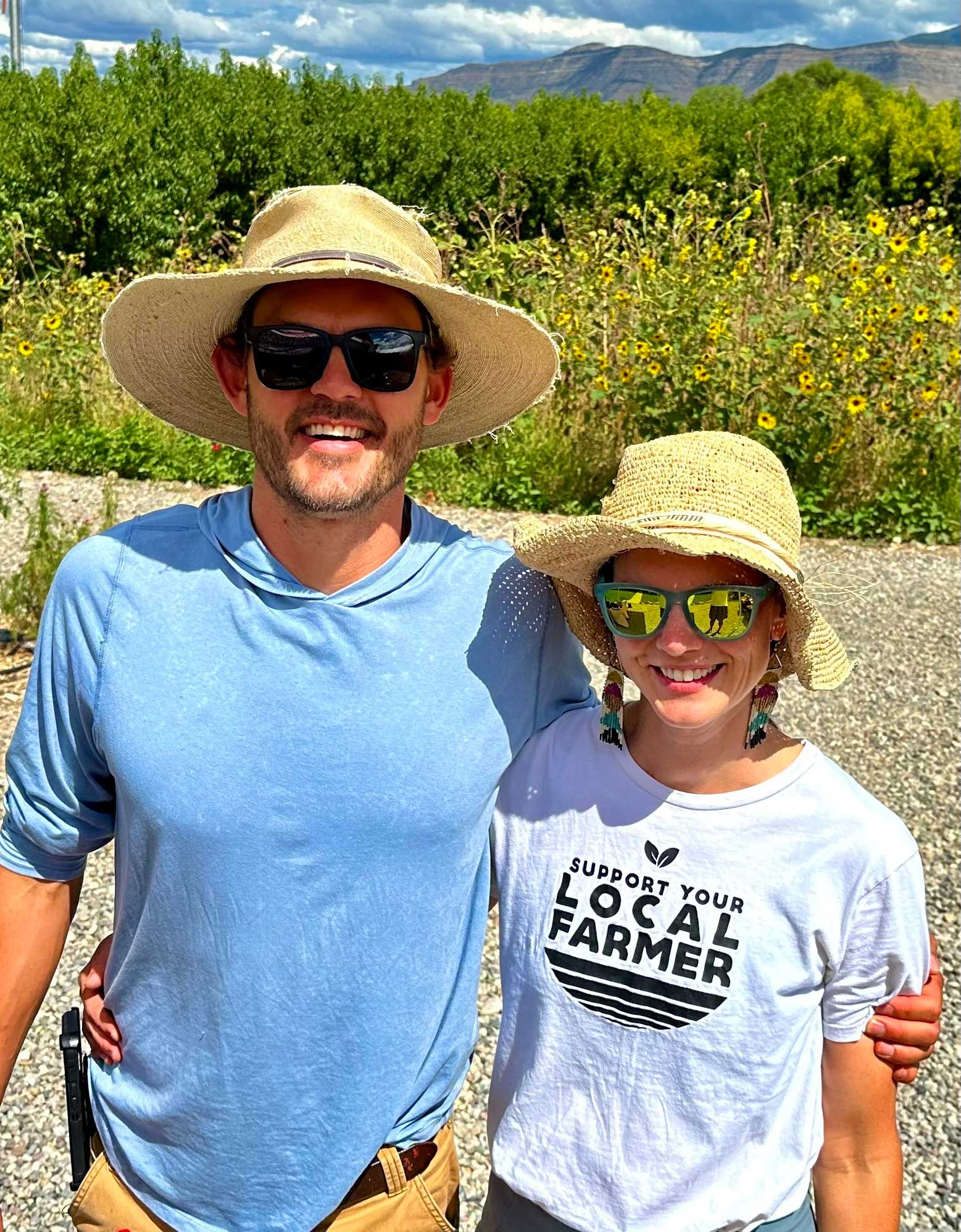 Luke and Annie Gingerich smile for the camera on a sunny day.