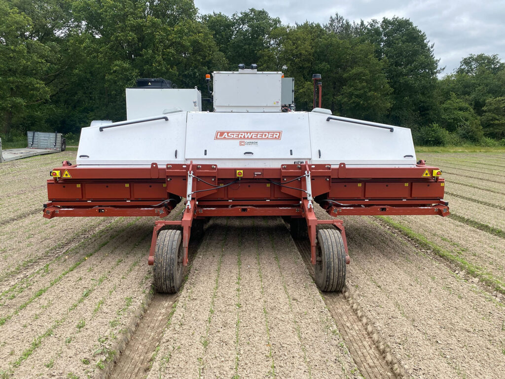 Large piece of farm equipment in a field.