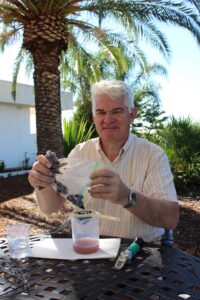Marcus Meadows-Smith tests winegrapes to to determine when they are ready for processing.