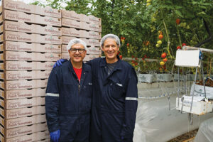 Ricardo Cristantes and Theojary Cristantes Jr. in a Wholesum greenhouse