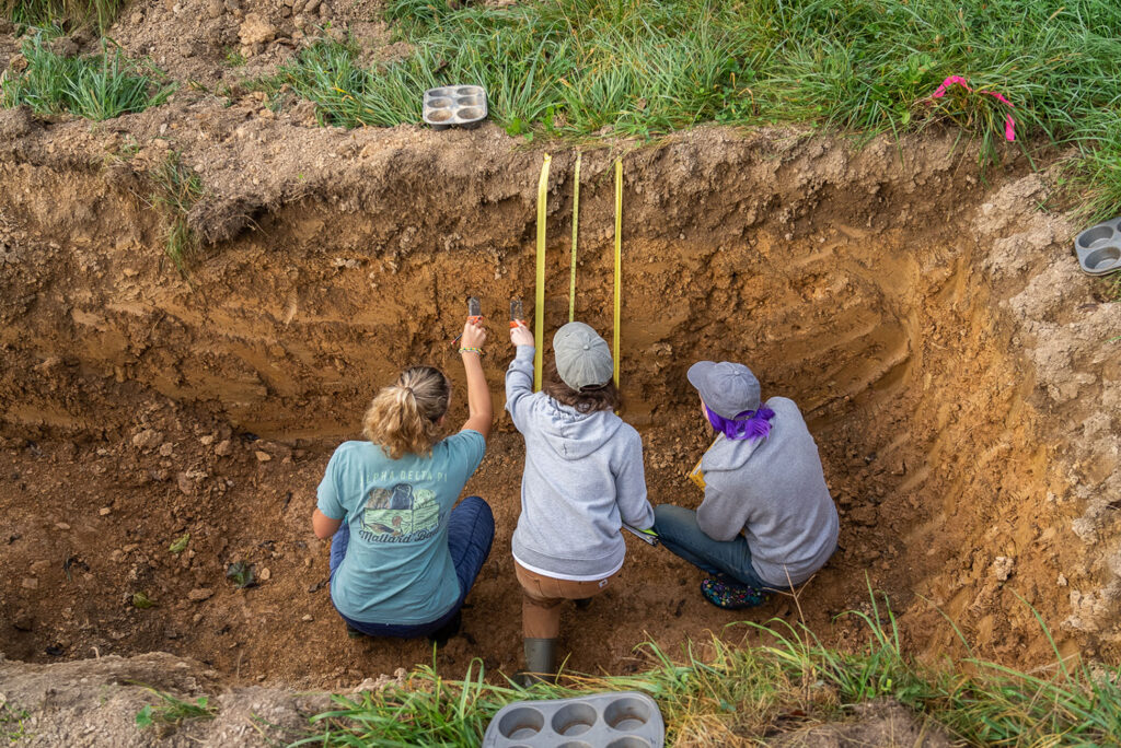 Participants collect the soil samples from their designated sites during the Northeast Regional Soil Judging Contest at the Rodale Institute. Credit: Rodale Institute