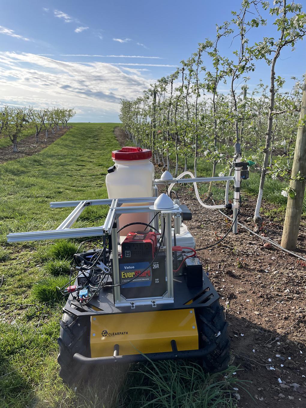 The researchers plan to develop an autonomous system capable of traversing orchards to precisely manage crops at the flower stage. It will consist of an advanced machine vision component, artificial intelligence to precisely manage the crop load at the flower stage and precision sprayer system to apply chemical thinner targeted at the flower clusters in tree canopies. Credit: Penn State. Creative Commons