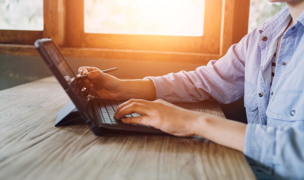 Businesswoman hand working with laptop.